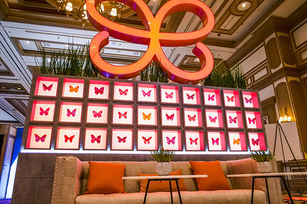evolus-brand-activation-trade-show-booth-butterfly-wall-fgpg-experiential-600x400