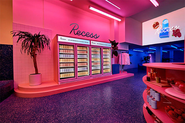 recess pop-ups shop with pink walls and palm trees