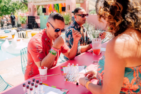 men sitting at a fragrance bar at an instagram coachella pop up experience