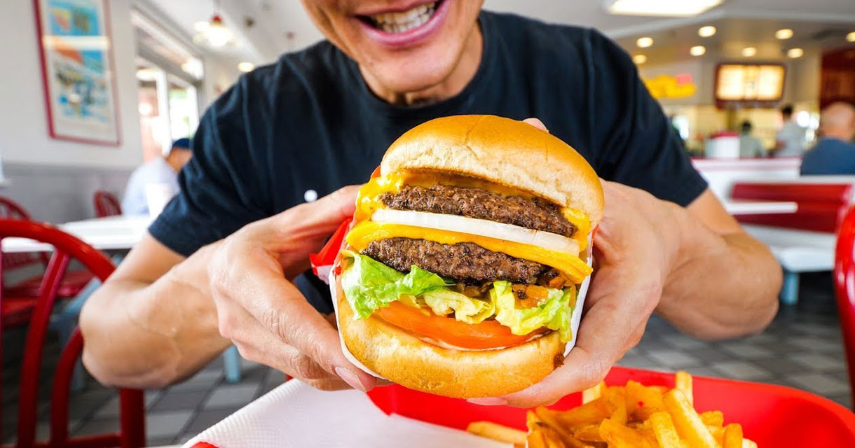 man holding an in-n-out double double