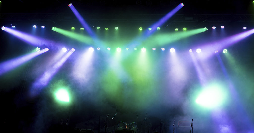 Purple and green stage lights with haze for experiential marketing